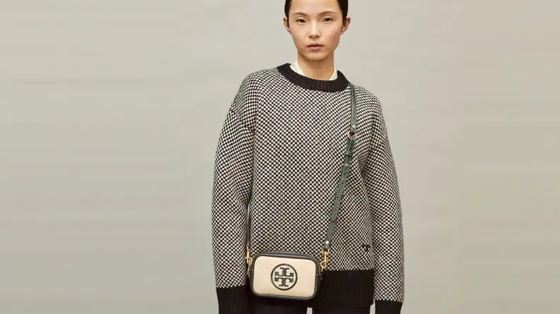 White crossbody bag being worn