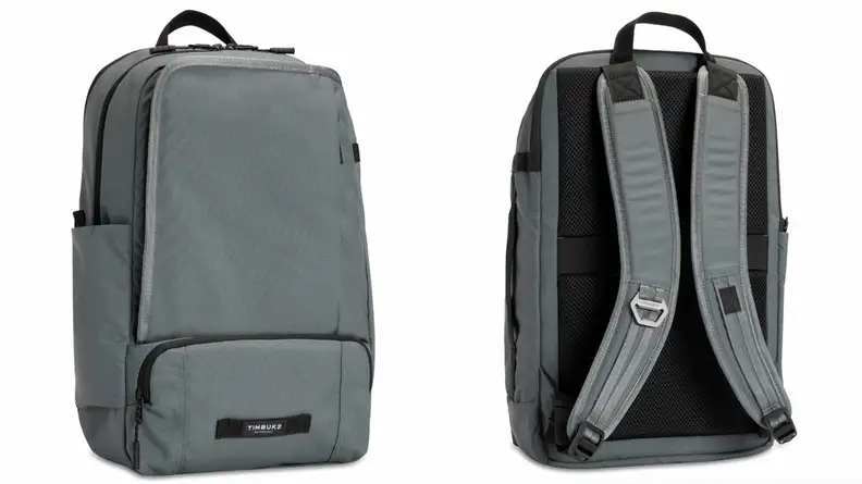 Grey bag standing upright from Timbuk2, backpack straps from Timbuk2 laptop bag.