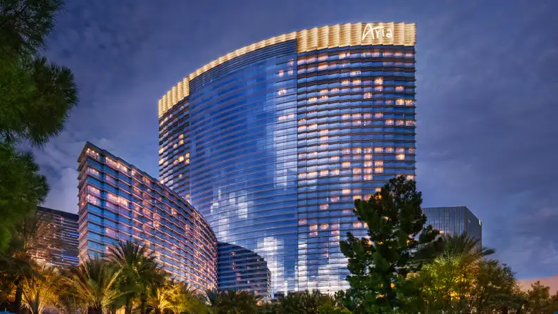 A brightly lit casino hotel at dusk