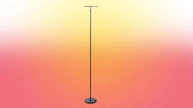 A lamp stands on a red and yellow fade background