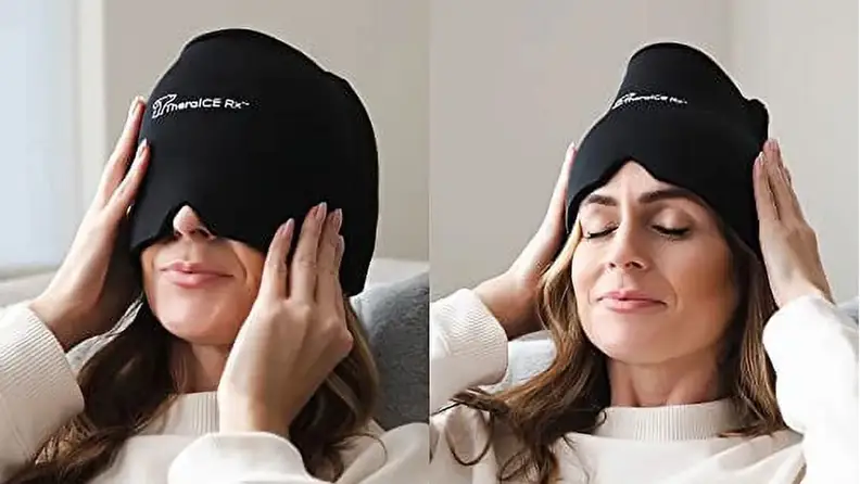 Person grinning while pulling TheraIce RX migraine cap over eyes to receive headache relief.