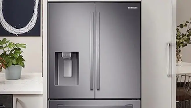 Stainless steel double door refrigerator in kitchen