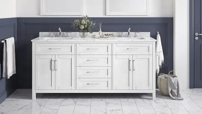 White marble bathroom sink against navy blue wall