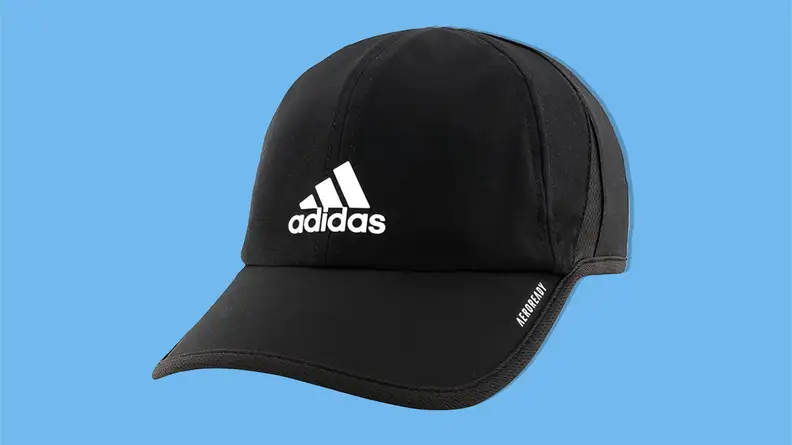 Adidas Men’s Superlite Relaxed Fit Performance hat on a blue background.