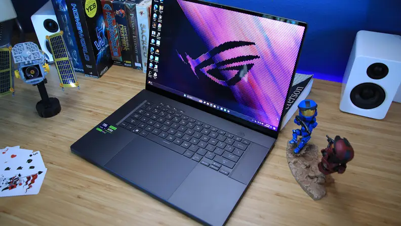 The Asus ROG Zephyrus G16 laptop sitting on a desktop.