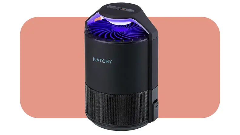 Product shot of the Katchy Indoor Insect Trap with blue UV shining on top in front of pink background.