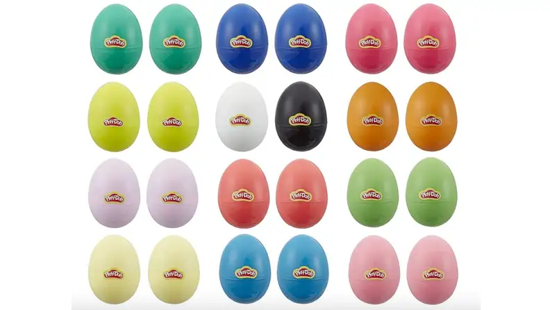 Two dozen, brightly colored Easter eggs filled with Play-doh