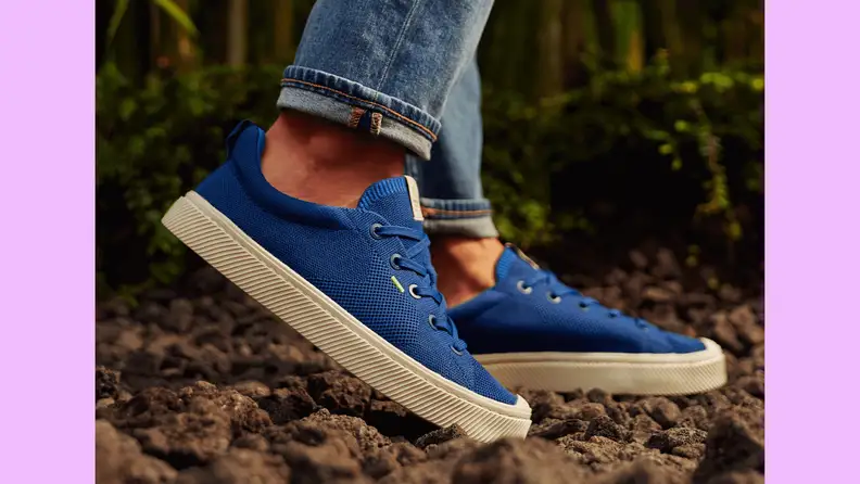 Close-up of sneakers on the ground.
