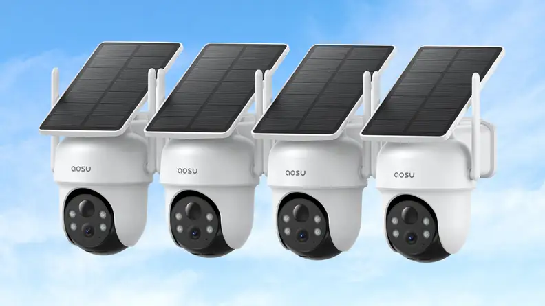 A group of four security cameras, with sky behind them