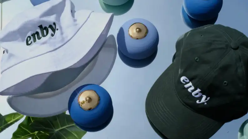 Sex toys and two enby-branded hats