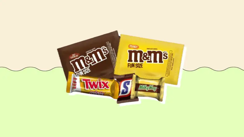 Various chocolate candies on a green and beige background