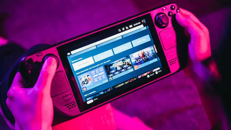 The Valve Steam Deck console being played in a person's hands