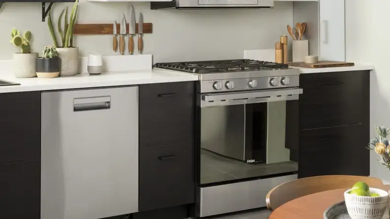 A lifestyle image of a sleek modern kitchen with a stainless steel gas range.