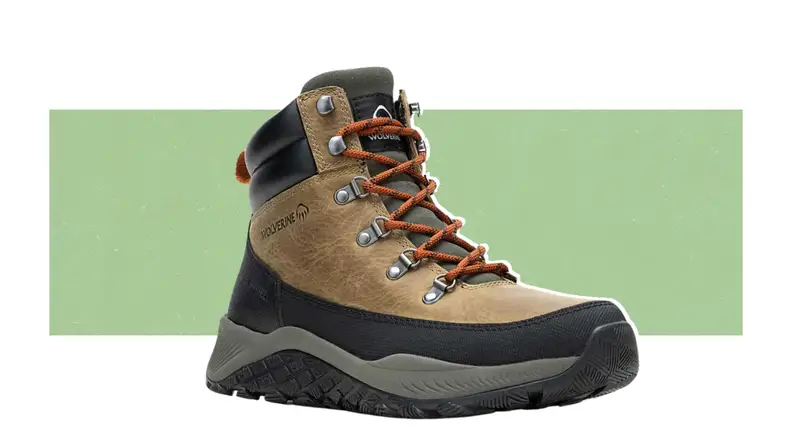 A Wolverine boot on a green background.