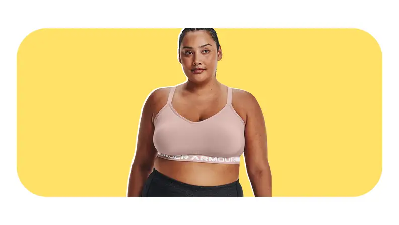 Model wearing athletic Under Armour sports bra and leggings