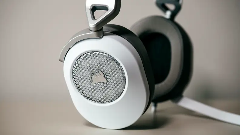 Close up of headset against beige background.