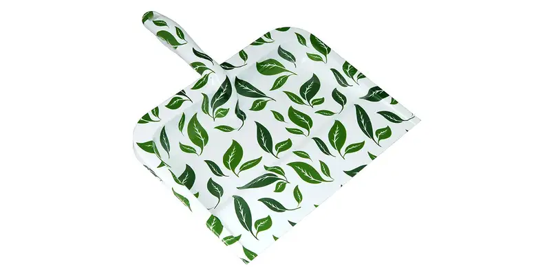 A cute, leafy dustpan has a sharp, strong edge.