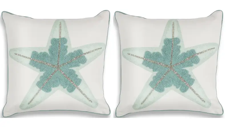 Blue starfish on a white pillow