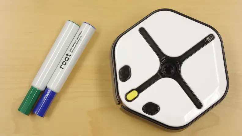 The Root Robotics kit comes with the robot, two dry erase markers, and a foldable whiteboard grid.