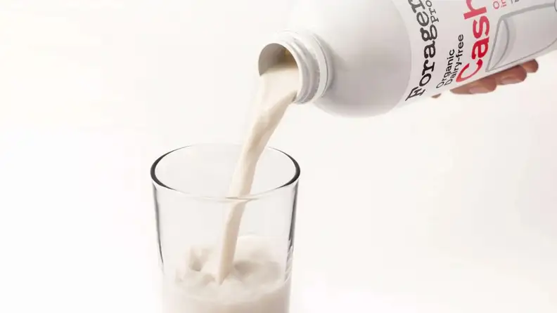 Forager cashew milk pouring into a glass