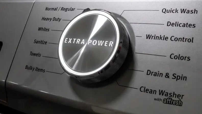 A giant, imposing cycle select dial with an all-caps "EXTRA POWER" written across its center.