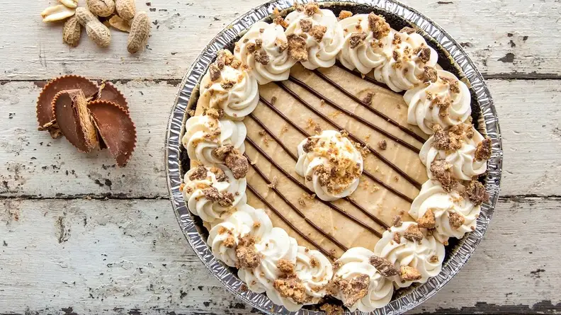 Peanut butter cream pie on a wooden background