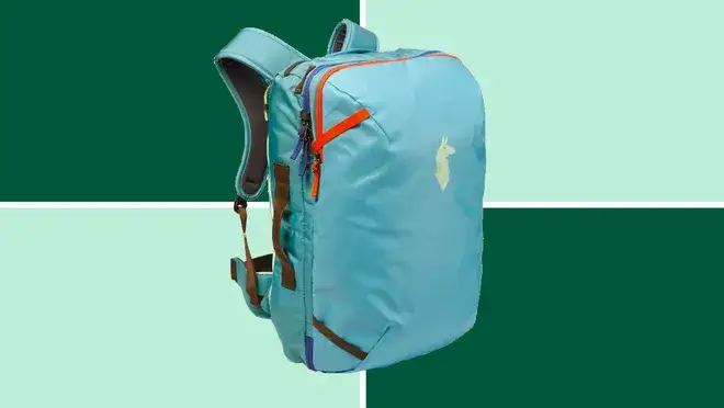A Cotopaxi Allpa 35 L Travel Pack on a dark and light green background.