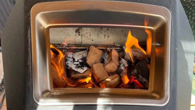 Burning wood in the back of the Ooni Karu 16 oven.