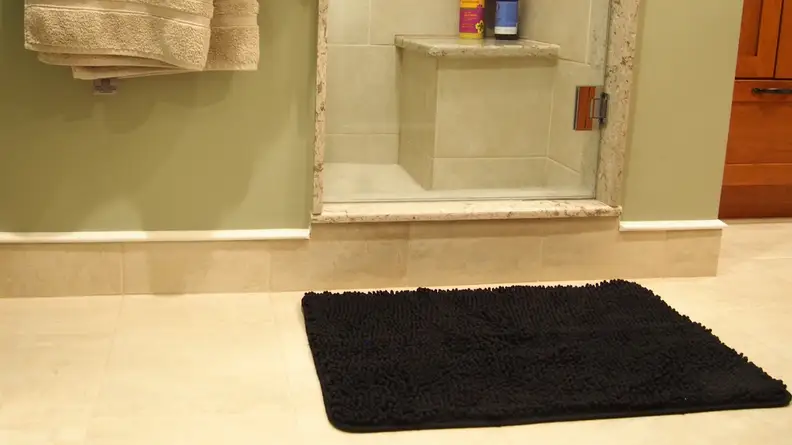 A stylish bath mat can brighten up your space.
