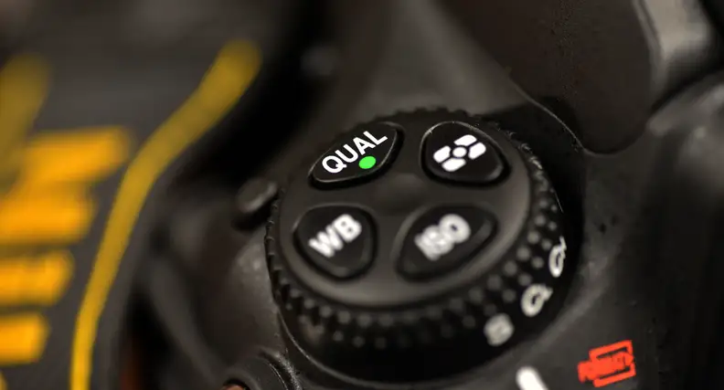 The top control cluster is one of the few layout changes compared to the D800, with the bracket button getting relocated.