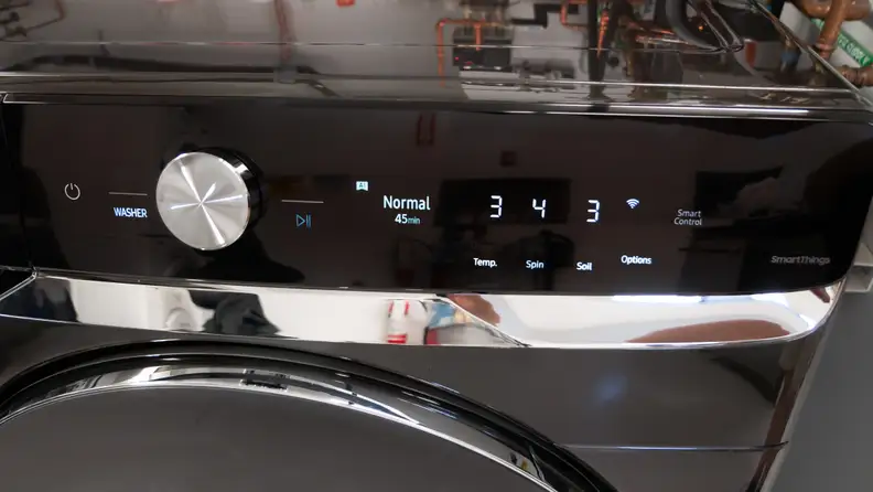 Close-up shot of the signature smart dial in the middle of the smart control settings panel on the Samsung WF50A8800AV Front-load Washing Machine.