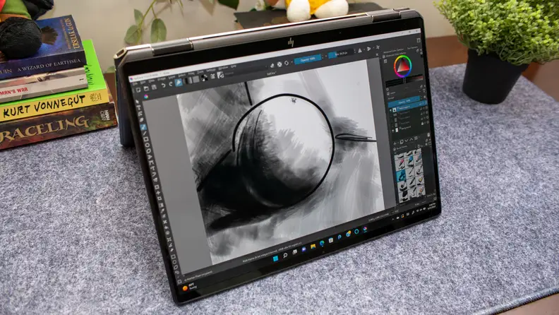 The HP Spectre in stand-mode on a marble counter.