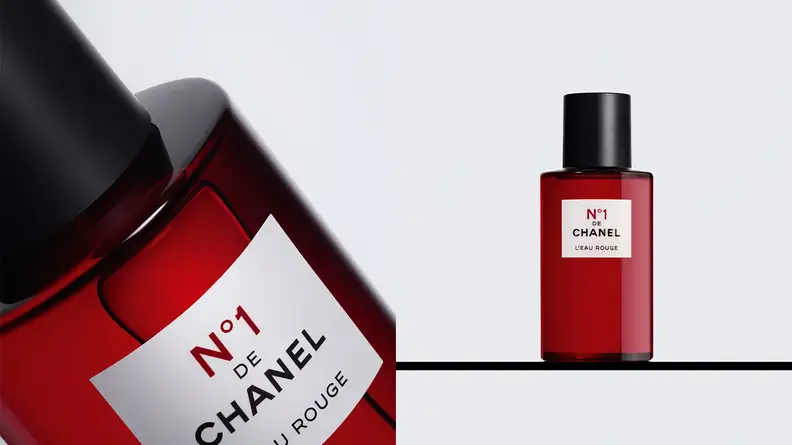 On the left: A closeup on a red transparent fragrance bottle with a white square label on it. On the right: A red transparent bottle of fragrance standing on a shelf.