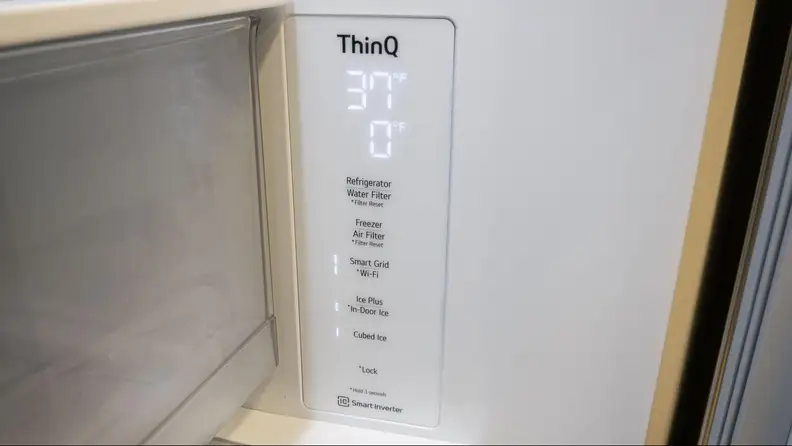The refrigerator's thermometer at 37°.