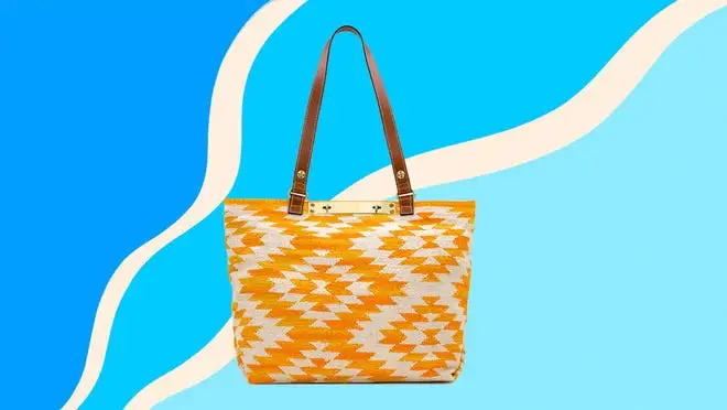 A printed yellow handbag against a blue background.