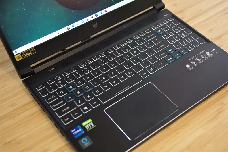 An Acer Predator Helios 300 gaming laptop on a desk.
