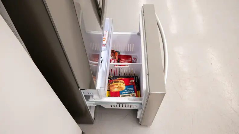 A close-up of the freezer drawer opened, with its inset drawer pulled out slightly.