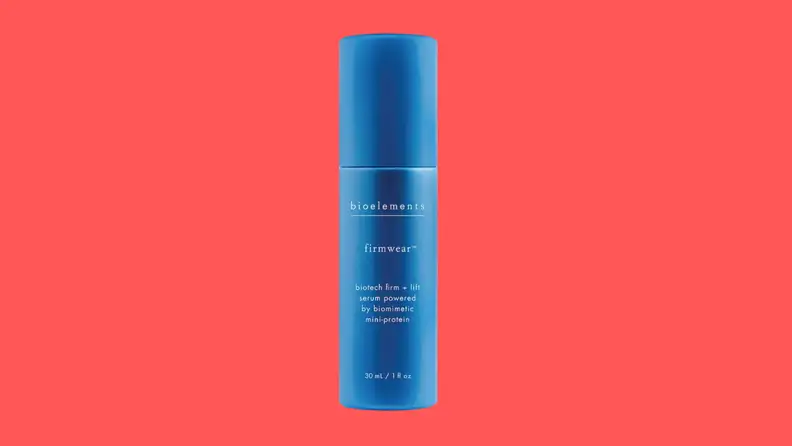 A blue bottle of serum on a red background