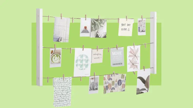 Clothesline collage with hanging photos and affirmations hanging.