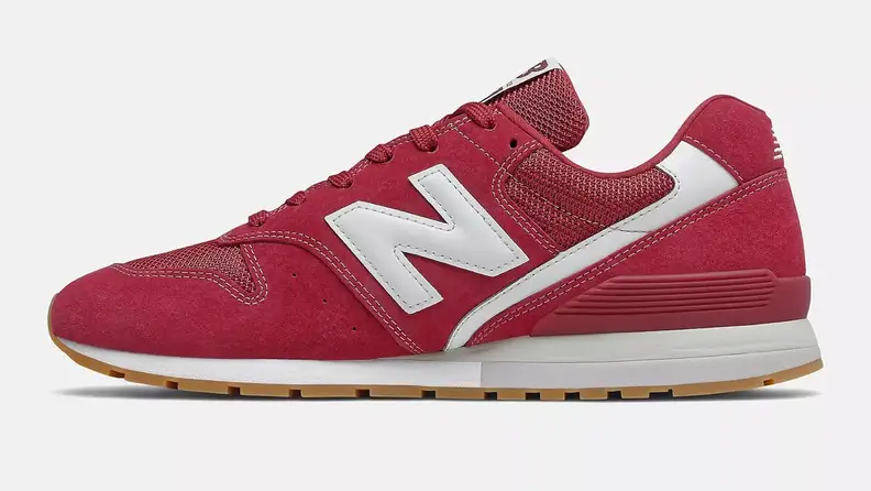 A red New Balance 996 shoe against a white background.