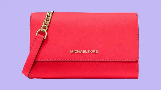 Reddish pink crossbody against a purple background