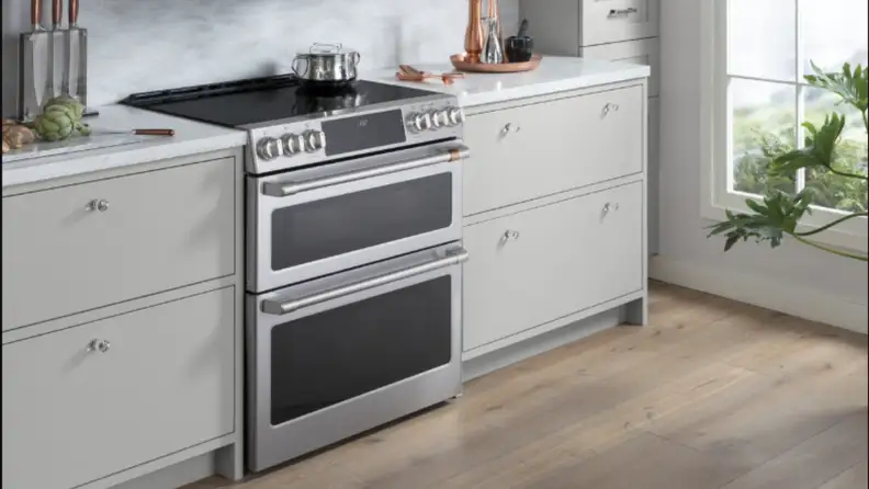 A range sits in cabinetry in a kitchen setting
