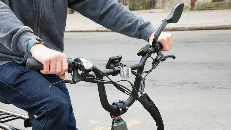 The handlebars of the RadPower 3 Plus with control panel and throttle.