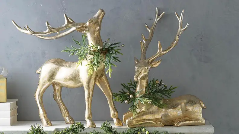 These sweet animals have holiday wreaths around their necks.