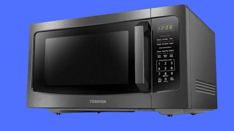 A black microwave on a blue background