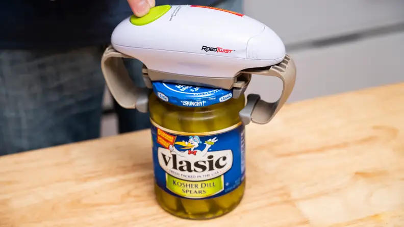 Our tester removes a Vlasic dill pickle jar's lid using the Robo Twist electric jar opener.