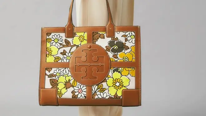 Brown leather handbag with yellow flowers