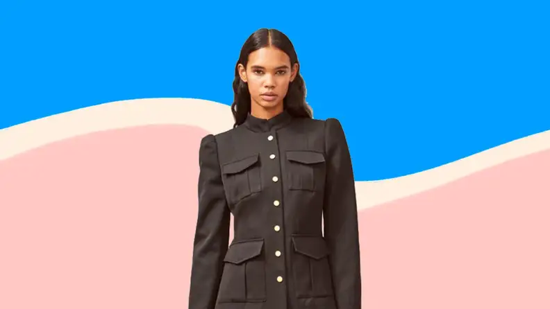 Woman wearing black on blue and pink background