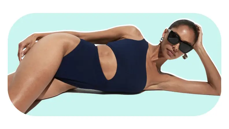 A navy-blue one-piece swimsuit with cutouts.