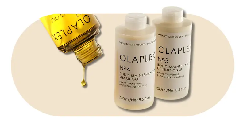 Olaplex No. 4 Bond Maintenance Shampoo, No. 5 Bond Maintenance Conditioner, and No. 7 Bonding Oil on a beige background.